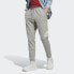 Фото #1 товара adidas men Essentials Single Jersey Tapered Badge of Sport Pants