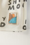Printed bermuda shorts with slogan and label