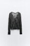 Semi-sheer creased-effect beaded jacket