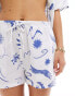 Iisla & Bird printed beach short co-ord in white and blue