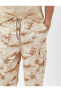Фото #5 товара Брюки мужские Koton Карго с поясом на завязке и карманами в камуфляжном принте