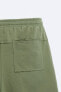 BERMUDA SHORTS WITH UNEVEN TRIMS