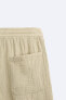 Creased-effect bermuda shorts