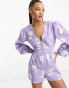 Фото #1 товара Miss Selfridge linen look button through playsuit in lilac hibiscus print