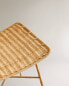 Metal stool with woven rattan