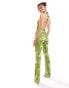 ASOS DESIGN slim leg cut out detail jumpsuit in neon green snake print