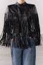 Short leather cape with fringing