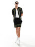 Фото #1 товара ASOS DESIGN co-ord knitted shorts in black with green border