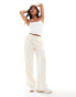 Vero Moda Petite wide leg tie waist trousers with textured applique in cream