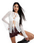 Фото #1 товара ASOS DESIGN textured rib tie front long sleeve flute top in ivory