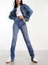 Фото #1 товара Bershka split hem high waisted jeans in mid blue wash