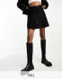 In The Style Tall exclusive box pleat denim mini skirt in black