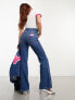 Фото #5 товара Wrangler Barbie co-ord flared jeans in mid blue