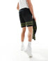 ASOS DESIGN co-ord knitted shorts in black with green border