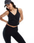 Фото #1 товара ASOS 4505 soft touch vest top with ruched front and inner bra in black