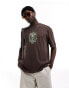 ASOS DESIGN oversized t-shirt in brown with emblem chest print Коричневый, XS - Chest 36 - фото #1