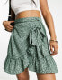 Фото #2 товара Only ruffle wrap mini skirt in green spot