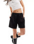 Фото #1 товара Weekday Ada track shorts with pull-on elasticated waistband in black