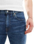 Фото #5 товара Levi's 502 taper fit jeans in mid blue