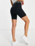 Фото #4 товара Nike high rise 7 inch legging shorts in black