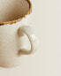 Porcelain mug with antique finish rim