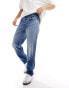 Lee Oscar relaxed tapered fit distressed jeans in mid vintage wash