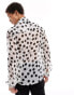 ASOS DESIGN relaxed polka dot shirt with tie neck in white and black