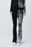 Faded-effect ribbed trousers