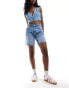 Bershka high waisted raw hem longline denim shorts in mid blue