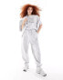 Фото #1 товара ASOS DESIGN jogger co-ord with sports graphic logo in ice marl