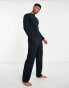 ASOS DESIGN pyjama set with long sleeve turtle neck top with tie back and trousers in black