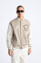 Bomber jacket with patches