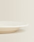 Earthenware dessert plate with raised-design edge