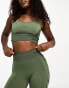 Hummel Seamless mesh insert sports crop top in dark green