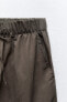 Nylon trousers with zips