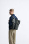 Rubberised backpack with flap