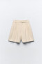 High-waist pleated bermuda shorts