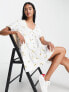 ASOS DESIGN button through mini smock dress in white with yellow floral embroidery