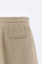 Textured mesh bermuda shorts