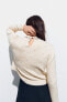 Knit sweater with faux pearls
