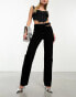 ASOS DESIGN mid rise straight jean with cut out waistband in washed black