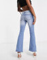 Фото #8 товара Miss Selfridge Petite low rise raw waistband flare jean in mid wash blue