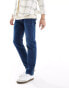 Фото #4 товара Levi's 502 tapered fit jeans in mid blue