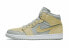 Фото #3 товара Кроссовки женские Nike Air Jordan 1 Mid смешанные текстуры желтые
