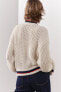 Knit jacket with piped seams