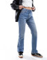 Фото #1 товара ASOS DESIGN mid rise straight jeans in mid blue