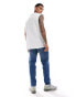 ASOS DESIGN stretch tapered jeans in mid wash blue