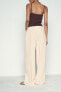 CREASED-EFFECT WIDE-LEG TROUSERS