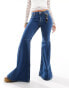 Monki Kikki comfort stretch low rise super flared jeans in blue wash