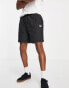 Puma logo quilted shorts in black exclusive to ASOS